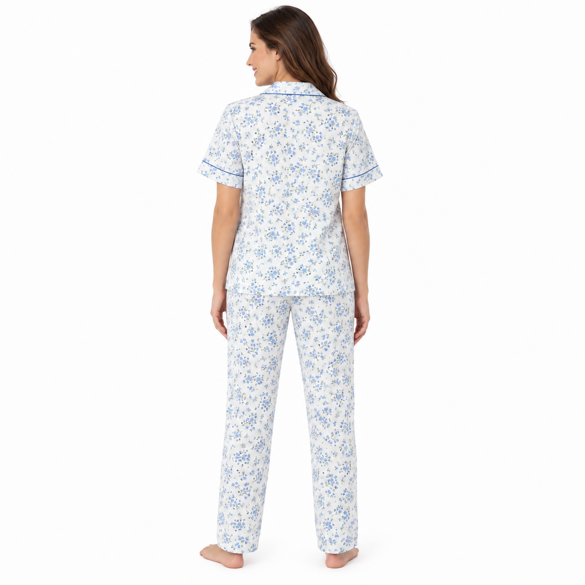Back view of the blue floral short-sleeve pyjama shirt and full-length trousers