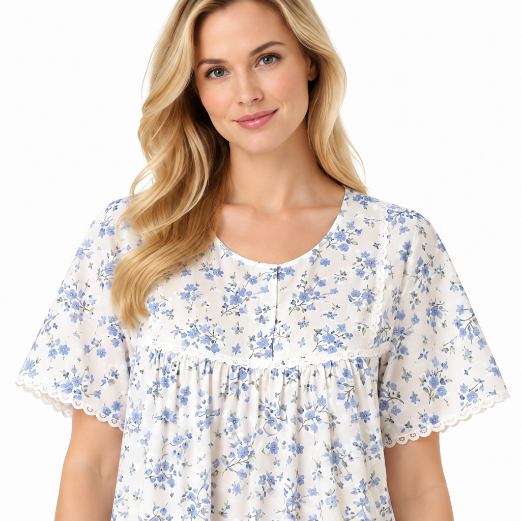 Close-up of blue floral nightdress showing round neckline, short button placket, gathered front and lace trim