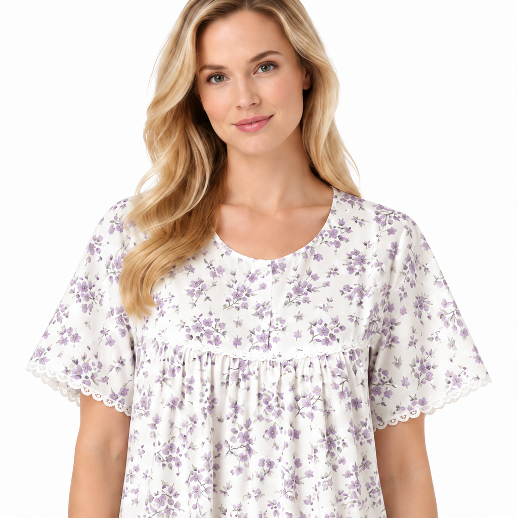 Close-up of lilac floral nightdress showing the round neckline, short button placket, gathers and lace trim