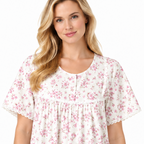 Close-up of pink floral nightdress showing round neck, front buttons, gathered front and lace edging