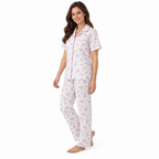 Side view of the pink floral pyjama shirt and straight-leg trousers